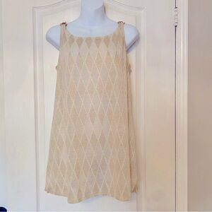 Sparkly top with 3 gold rings at shoulders